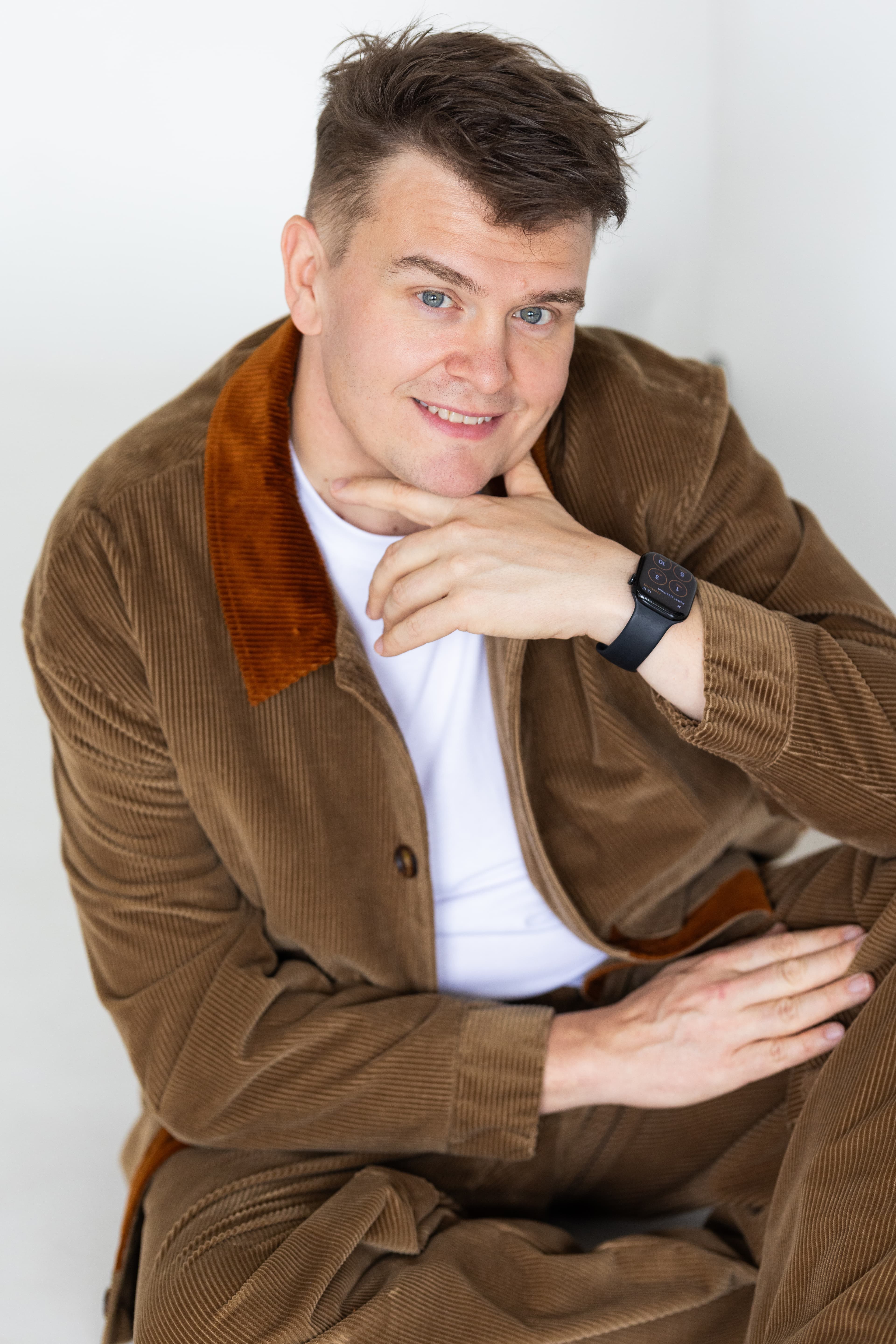 JP Pirinen seated, relaxed, in a brown corduroy jacket
